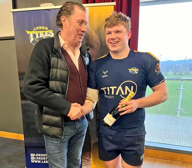 Adam Brown being presented Man of the Match