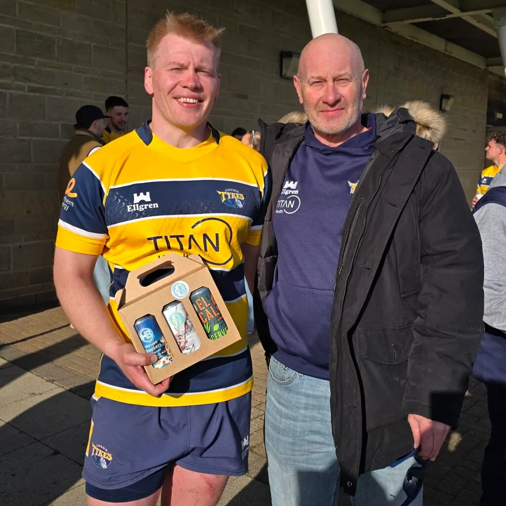 Connor Walker with his Dad and Player of the Match beer