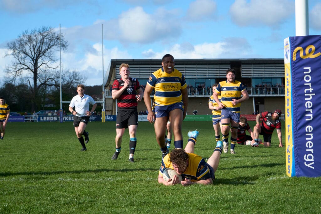 Jordan Cordice with Alex Pleasants scoring