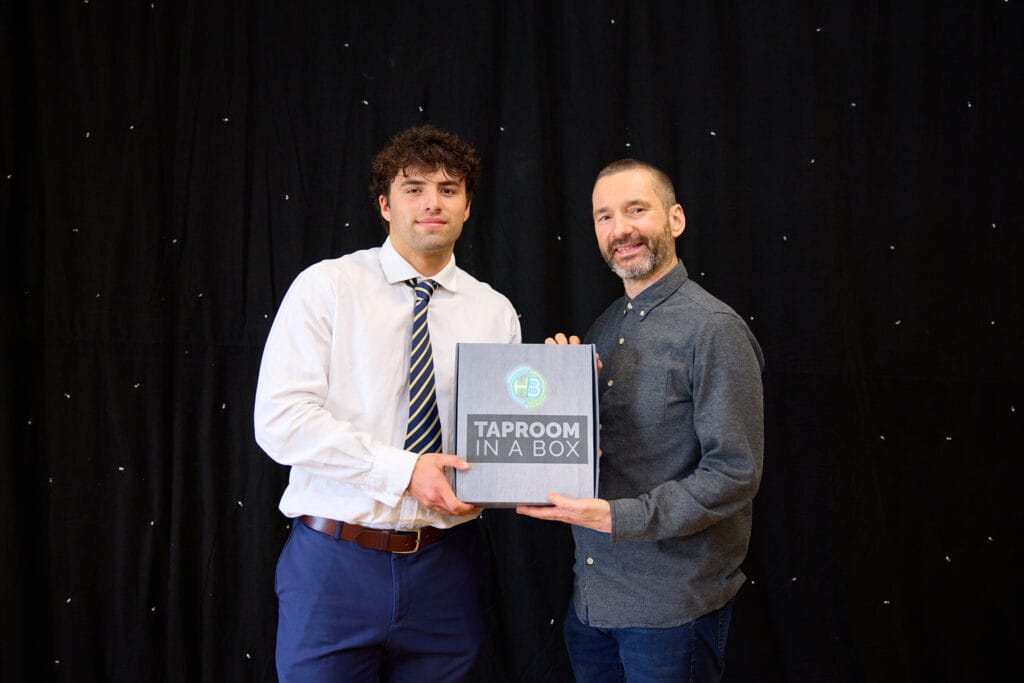 Steve Knowles from Cubby Studio presenting Sebi with his Try of the Season award