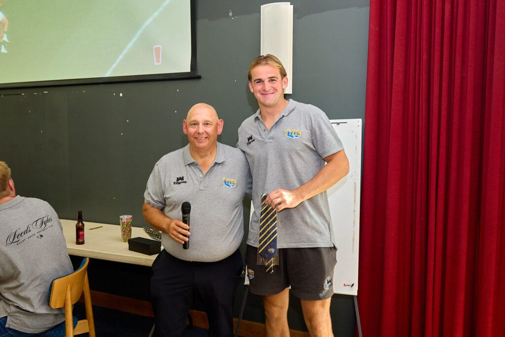 George Worthington being presented with his club tie on debut