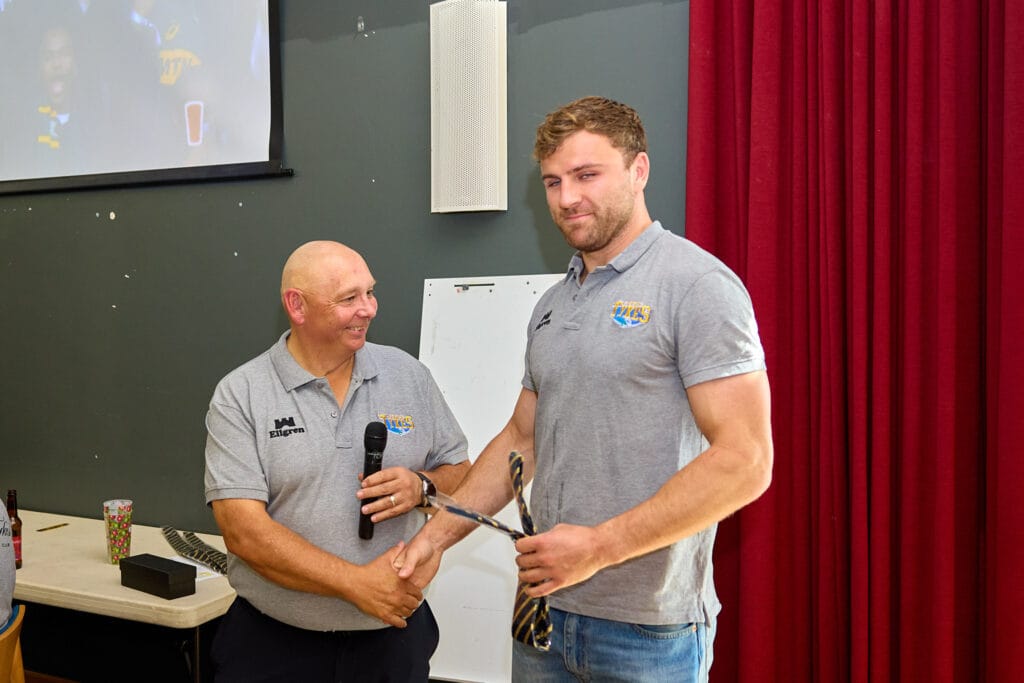 Kristan Dobson being presented with his club tie on debut