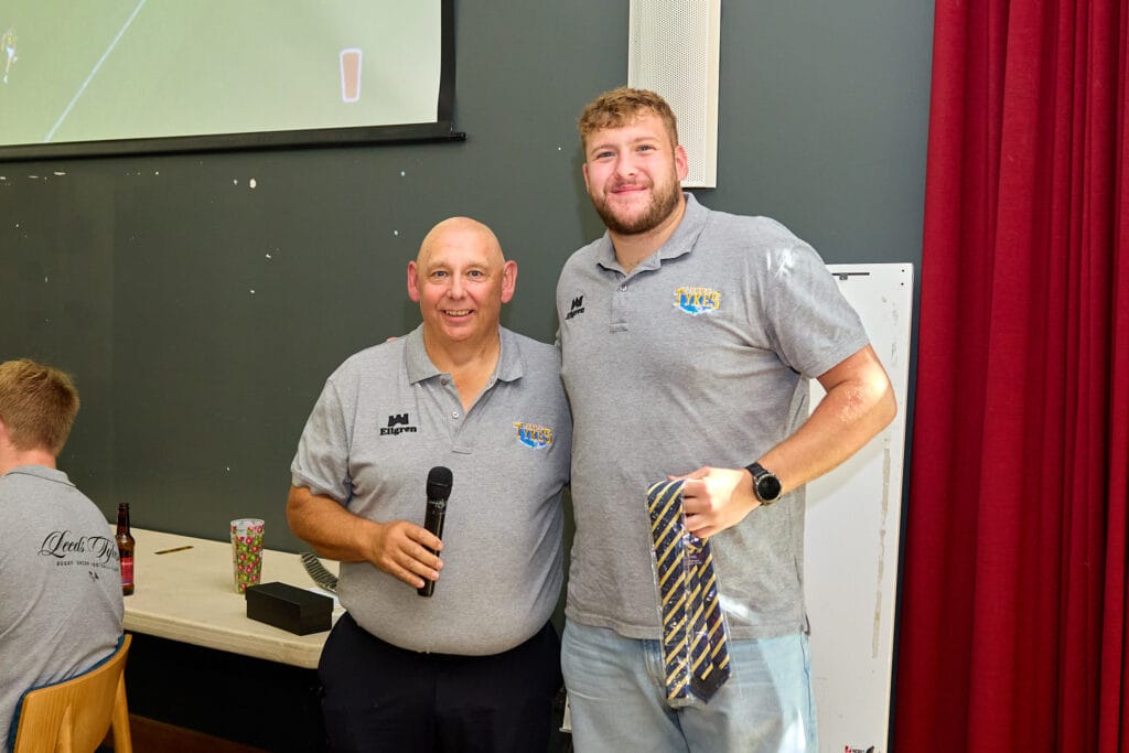 Matt Casselden being presented with his club tie on debut
