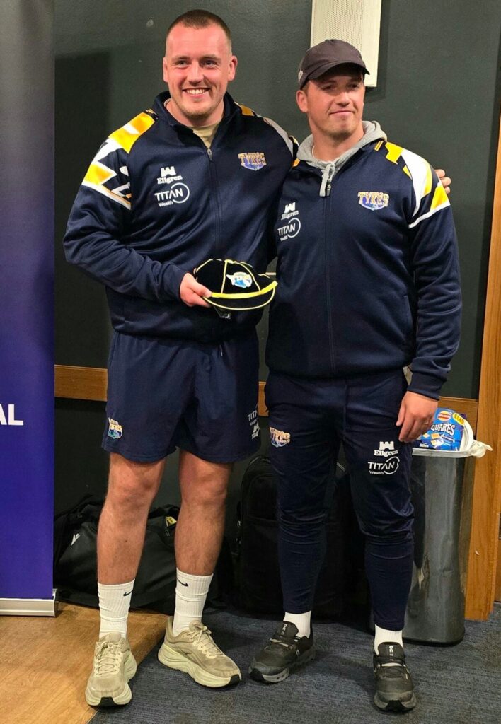 Tom Collins being presented with his 100th appearance club cap by Head Coach, Pete Lucock.