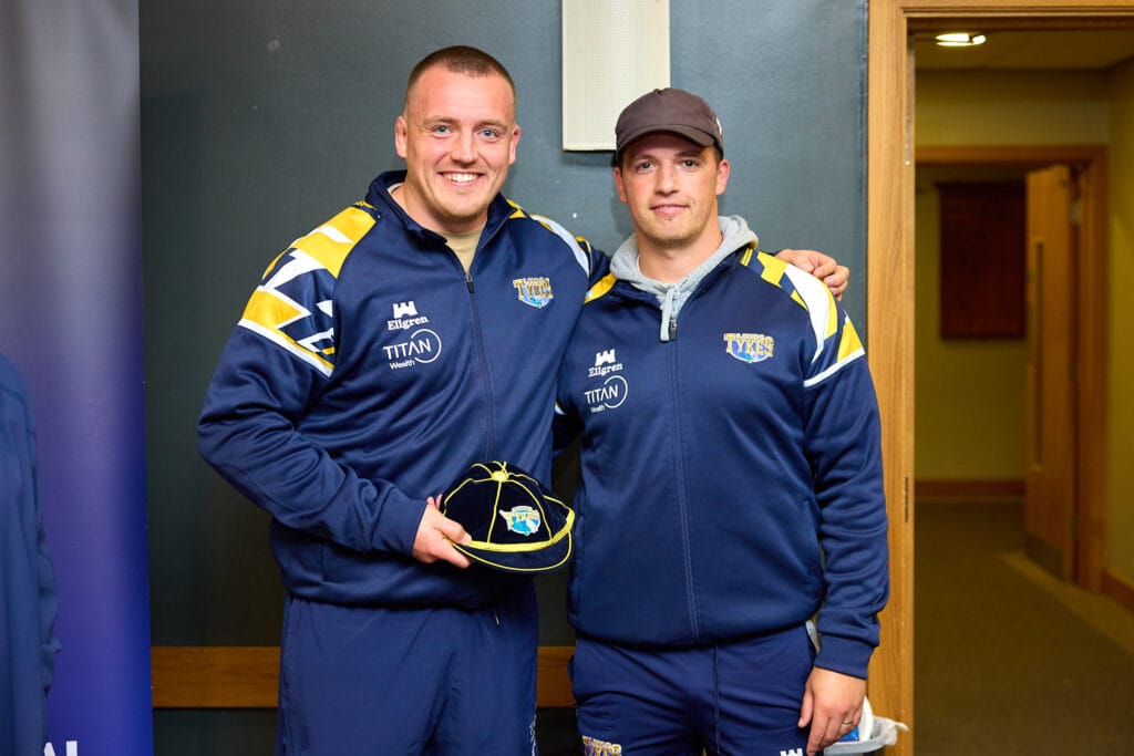 Tom Collins being presented with his 100th appearance club cap by Head Coach, Pete Lucock.